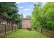 View of the house from the fenced backyard and a wooden deck at 2171 Wilson Nw Ave, Atlanta, GA 30314