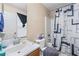 Bathroom featuring a shower with a blue and white curtain and a single sink at 2171 Wilson Nw Ave, Atlanta, GA 30314