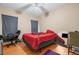 Comfortable bedroom with hardwood floors, a ceiling fan, and natural light for a peaceful retreat at 2171 Wilson Nw Ave, Atlanta, GA 30314