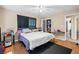 Bedroom featuring hardwood floors, neutral walls, and a view into an adjacent room at 2171 Wilson Nw Ave, Atlanta, GA 30314