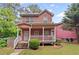 Charming two-story home with a welcoming front porch and well-maintained yard, perfect for Gathering living at 2171 Wilson Nw Ave, Atlanta, GA 30314