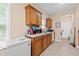 Functional kitchen with wood cabinets, tile floors, and modern appliances, making cooking a breeze at 2171 Wilson Nw Ave, Atlanta, GA 30314
