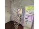 Open-air balcony features outdoor seating and elegant chandelier at 2865 Lenox Ne Rd # 211, Atlanta, GA 30324