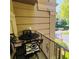 Cozy balcony features outdoor seating overlooking greenery at 2865 Lenox Ne Rd # 211, Atlanta, GA 30324
