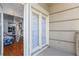 View from Balcony with chandelier looking into living room with new appliances at 2865 Lenox Ne Rd # 211, Atlanta, GA 30324