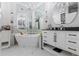 Bright bathroom featuring a standalone tub, dual chandeliers, and elegant fixtures at 2865 Lenox Ne Rd # 211, Atlanta, GA 30324