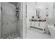 Modern bathroom features a glass-enclosed shower, chandelier, and luxurious fixtures for a spa-like experience at 2865 Lenox Ne Rd # 211, Atlanta, GA 30324