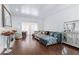 Spacious living room showcasing a plush blue sectional, hardwood floors, and decorative accents creating a cozy atmosphere at 2865 Lenox Ne Rd # 211, Atlanta, GA 30324