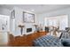 Charming living room features a fireplace and plush sofa, ideal for relaxation and entertaining at 2865 Lenox Ne Rd # 211, Atlanta, GA 30324