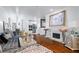 Elegant living room features a fireplace, hardwood floors, and stylish decor for comfortable living at 2865 Lenox Ne Rd # 211, Atlanta, GA 30324