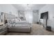 Elegant main bedroom featuring a silver color scheme, carpet, and a dazzling chandelier at 2865 Lenox Ne Rd # 211, Atlanta, GA 30324