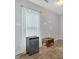 Bedroom with wood laminate flooring, a window with light curtain and small fridge at 902 Allene Sw Ave, Atlanta, GA 30310