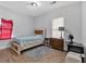 Cozy bedroom features wood laminate flooring and natural light from two windows at 902 Allene Sw Ave, Atlanta, GA 30310