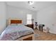 Comfortable bedroom with wood laminate flooring, a window, and a double bed at 902 Allene Sw Ave, Atlanta, GA 30310