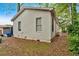 Exterior view of home's side and backyard featuring vinyl siding and mature trees at 902 Allene Sw Ave, Atlanta, GA 30310