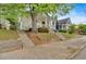 Quaint home featuring a cozy porch, landscaping, and a sidewalk at 902 Allene Sw Ave, Atlanta, GA 30310