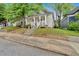 Lovely bungalow featuring a welcoming front porch and manicured lawn at 902 Allene Sw Ave, Atlanta, GA 30310