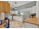 Functional kitchen featuring white cabinets, ample counter space, and neutral backsplash at 902 Allene Sw Ave, Atlanta, GA 30310