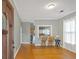 Open living space featuring hardwood floors, kitchen view, and natural light at 902 Allene Sw Ave, Atlanta, GA 30310