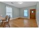 Inviting living room with hardwood floors, natural light, and a charming wood door at 902 Allene Sw Ave, Atlanta, GA 30310