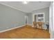 Spacious living room featuring hardwood floors, calming paint, and natural light at 902 Allene Sw Ave, Atlanta, GA 30310
