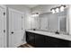 Bathroom featuring double sink vanity with granite countertop, undermount sinks, and hardwood floors at Lot 1 Perkins Rd, Dallas, GA 30157