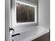 Close up of a soaking tub next to a window providing natural light at Lot 1 Perkins Rd, Dallas, GA 30157