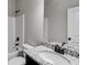 Well-lit bathroom with a vanity, soaking tub and shower combo at Lot 1 Perkins Rd, Dallas, GA 30157