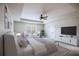 Spacious bedroom with tray ceilings, fan, large windows, and seating area offers a peaceful retreat at Lot 1 Perkins Rd, Dallas, GA 30157