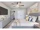 Spacious bedroom boasts ceiling fan, carpeted floor, tv and a comfortable bed with stylish bedding at Lot 1 Perkins Rd, Dallas, GA 30157