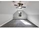 Cozy bedroom with a vaulted ceiling, fan, plush carpet, and a sunlit window at Lot 1 Perkins Rd, Dallas, GA 30157