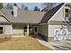 Single-Gathering home boasts a two-car garage, stone accents, gabled roof, and a well-maintained front yard at Lot 1 Perkins Rd, Dallas, GA 30157