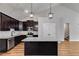 Modern kitchen with dark cabinets, granite counters, an island, and stainless steel appliances at Lot 1 Perkins Rd, Dallas, GA 30157