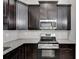 Kitchen featuring stainless steel appliances, dark cabinetry, and granite countertops at Lot 1 Perkins Rd, Dallas, GA 30157