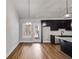 Modern kitchen with dark cabinetry, stainless steel appliances, island, and hardwood flooring at Lot 1 Perkins Rd, Dallas, GA 30157