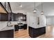 Kitchen featuring granite countertops, dark wood cabinetry, stainless steel appliances, and an island at Lot 1 Perkins Rd, Dallas, GA 30157