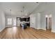 Open-concept living area featuring dark cabinetry, a kitchen island, and modern lighting at Lot 1 Perkins Rd, Dallas, GA 30157