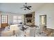 Cozy living room featuring a stone fireplace, comfortable seating, and wood-look flooring at Lot 1 Perkins Rd, Dallas, GA 30157