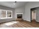 Spacious living room boasts hardwood floors, a stone fireplace, and natural light from large windows at Lot 1 Perkins Rd, Dallas, GA 30157