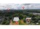 An aerial view shows the property's proximity to shopping and downtown, plus neighborhood dog park and other amenities at 1555 New Ne St, Atlanta, GA 30307