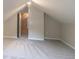 View of the attic featuring neutral walls, carpet, and overhead lighting at 1555 New Ne St, Atlanta, GA 30307