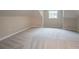View of the attic featuring neutral walls, carpet, and a window at 1555 New Ne St, Atlanta, GA 30307