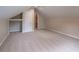 View of the attic featuring neutral walls, carpet, and an open closet at 1555 New Ne St, Atlanta, GA 30307