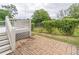 Spacious backyard area featuring a brick patio, deck, and a well-maintained lawn at 1555 New Ne St, Atlanta, GA 30307