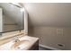 Cozy bathroom featuring a vanity with a beige countertop and a sleek, modern sink at 1555 New Ne St, Atlanta, GA 30307