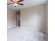 Serene bedroom with neutral walls, carpet, and a ceiling fan for added comfort at 1555 New Ne St, Atlanta, GA 30307