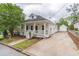 Quaint home with inviting front porch, long drive way and separate garage at 1555 New Ne St, Atlanta, GA 30307