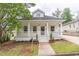 Charming craftsman home featuring a welcoming front porch and well-maintained landscaping at 1555 New Ne St, Atlanta, GA 30307
