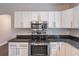Stainless steel appliances and ample cabinet space are the highlight of this modern kitchen at 1555 New Ne St, Atlanta, GA 30307
