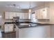 Well-lit kitchen with stainless steel appliances, granite countertops, and ample cabinet space at 1555 New Ne St, Atlanta, GA 30307